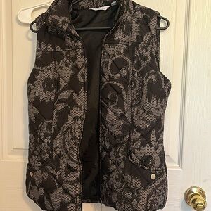 SIZE S, sleeveless puffy like jacket, not thick at all. Just right